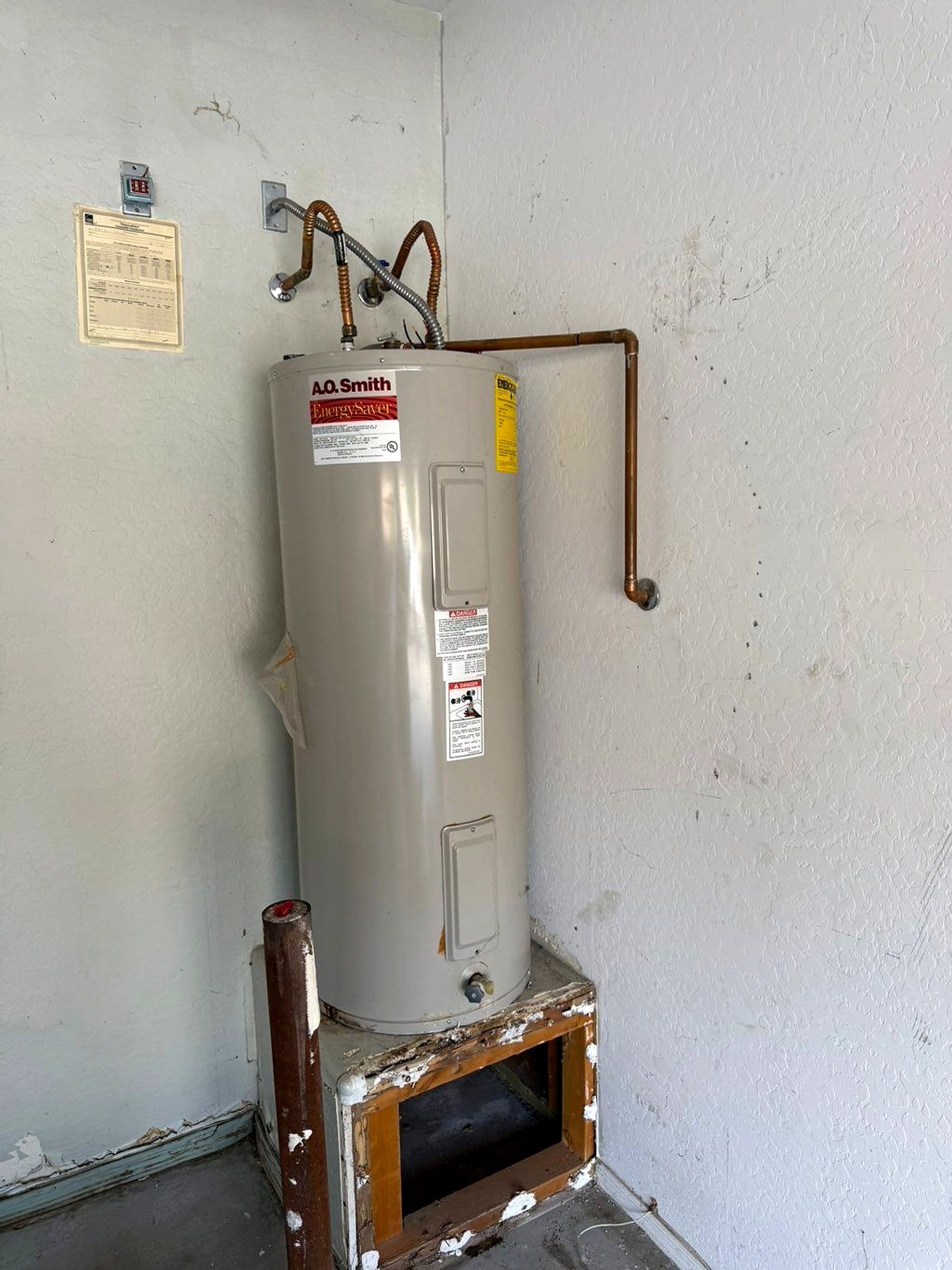 New water heater in a laundry corner